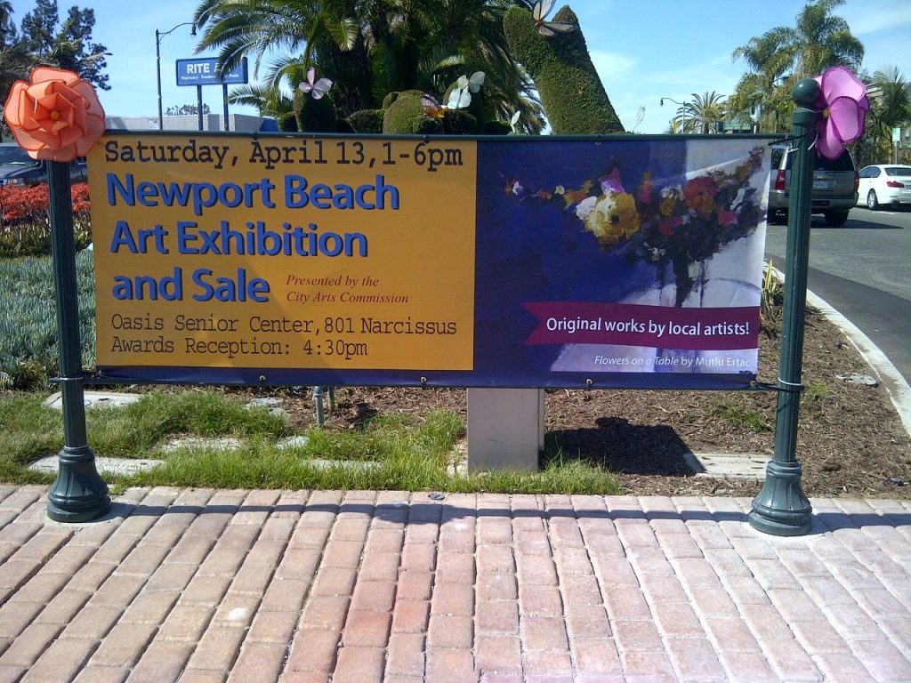 Street banner for the Newport Beach Art Exhibition and Sale, April 13, with Flowers on a Table by Mutlu Ertac.
